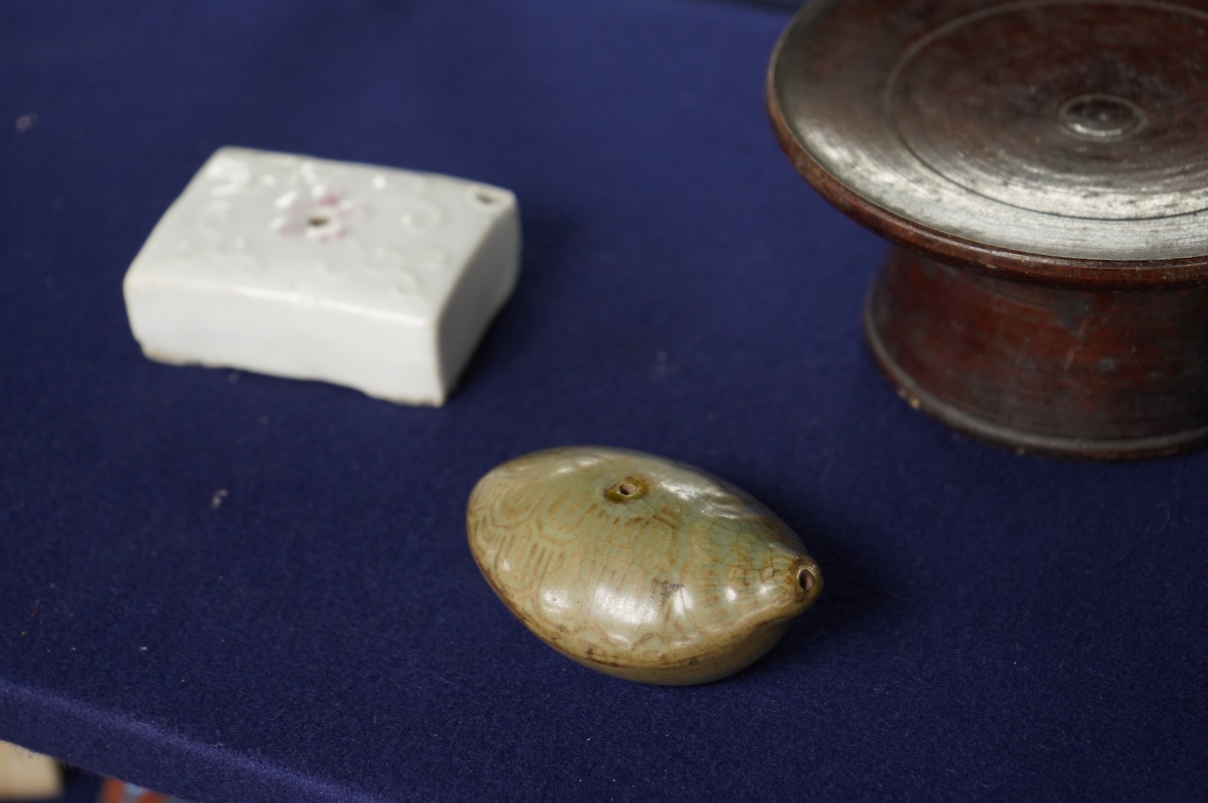 Two 19th century Korean ceramic water droppers and a Korean turned wood cup stand, oval water dropper 8cm long